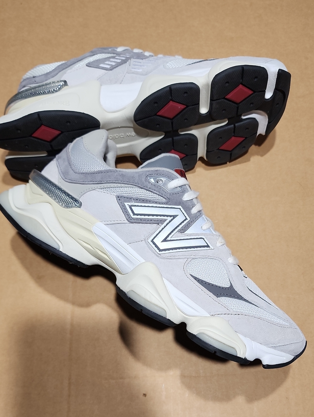New Balance 9060 Unisex low-top sneakers, gray and white. Size M 9.5 / W 11